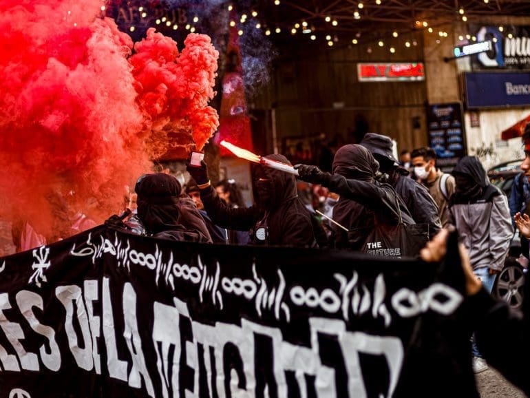 Anarchist group takes to the streets in Colombia protesting deaths and arrests from the 2021 National Strike