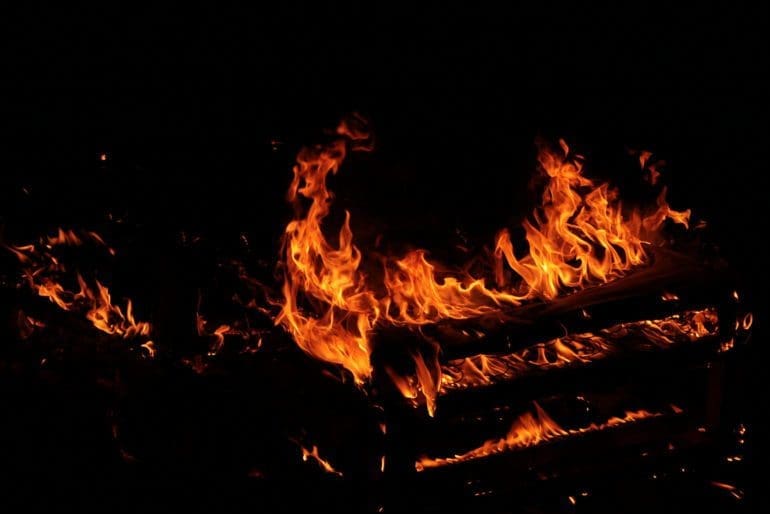 In an act of domestic violence, husband shoves woman onto burning bed in Zimbabwe