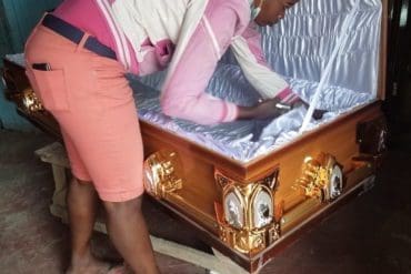 Afline Anyango is pictured at her coffin shop. Individuals and other shops purchase coffins from her.