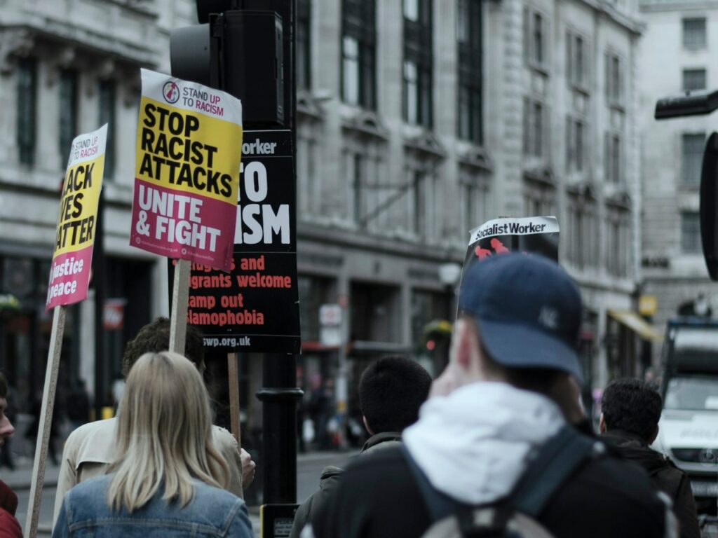 Recent far-right violence in Britain has put the immigrant community at risk, intensifying fear and anxiety. | Photo courtesy of Henry Be on Unsplash