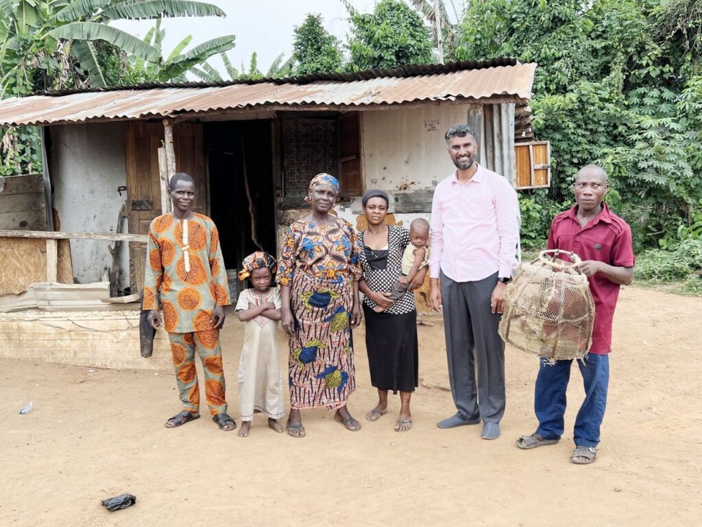 The Malligavad Foundation gained notoriety for its success in lake clean-up, resulting in projects in Africa. Here, Anand stands with Nigerian citizens who benefit from the project. | Photo courtesy of Anand Malligavad