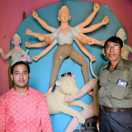 Arnab Ghosal and Sailen Ghosal in front of the incomplete Durga goddess