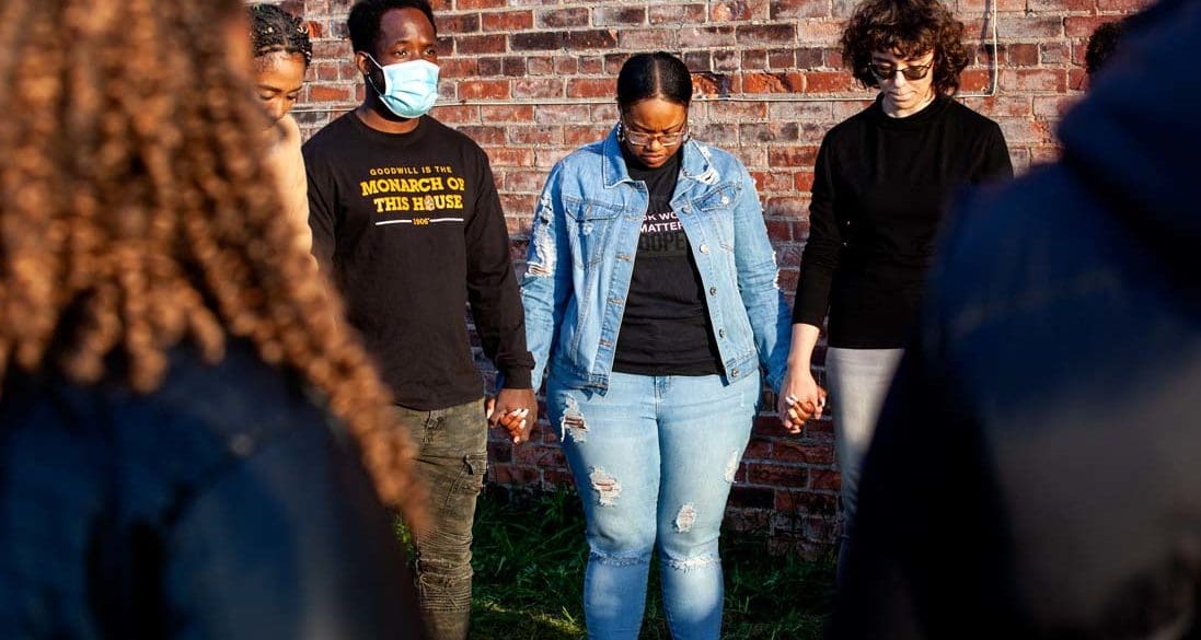 People gather at a community vigil to memorialize the victims of a racist attack in Buffalo, NY on May 14, 2022