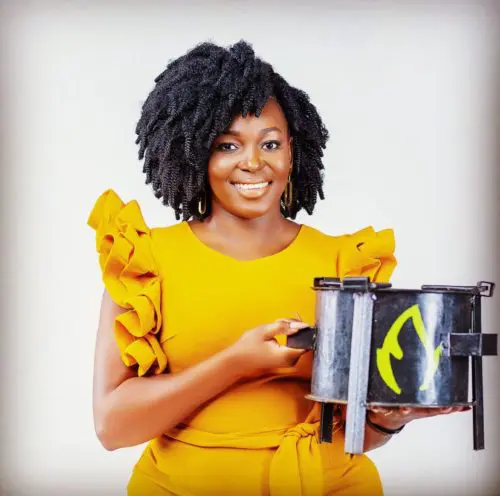 Charlot Magayi holds one of her Clean Stoves.
