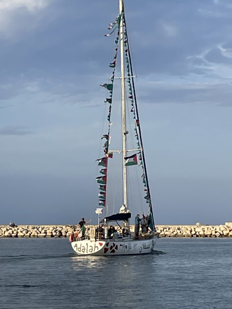 Gaza-bound flotilla sailboat Adalah displaying Palestinian flags