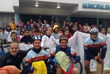 The members of El Cruce collecting letters at a school in Argentina
