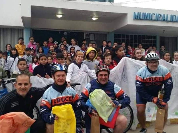 The members of El Cruce collecting letters at a school in Argentina