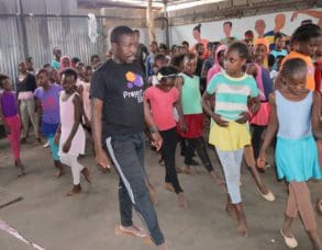 Mike Wamaya leads a dance class at Project Elimu. Hundreds of students have passed through his doors, learning life and social skills in addition to dance