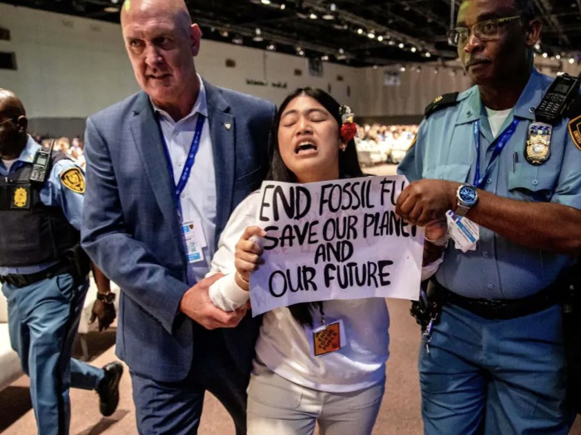 Licypriya Kangujam being dragged away by security after she disrupted a high-level session at COP28. | Photo courtesy shared with permission from Licypriya Kangujam's X page