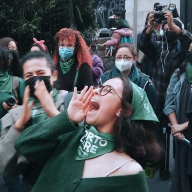 A woman shouts in the street as she celebrates the legalization of abortion in Colombia