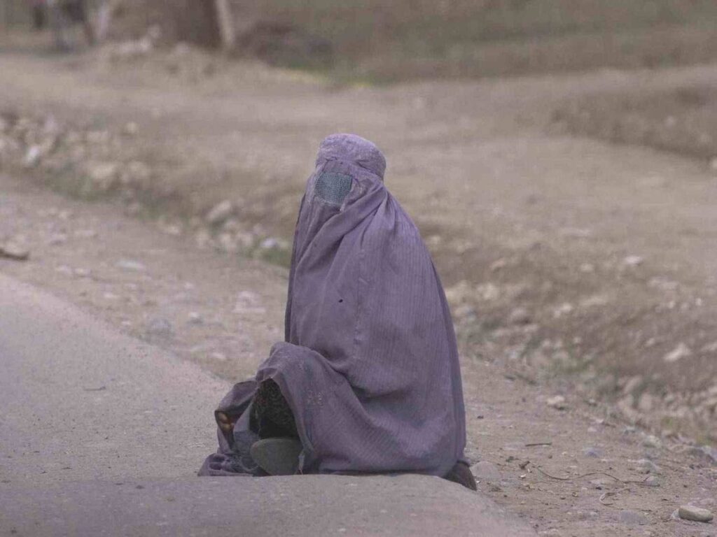 An undated photo of a woman in Afghanistan wearing a full burqa. | Photo courtesy of Davric on Wikimedia