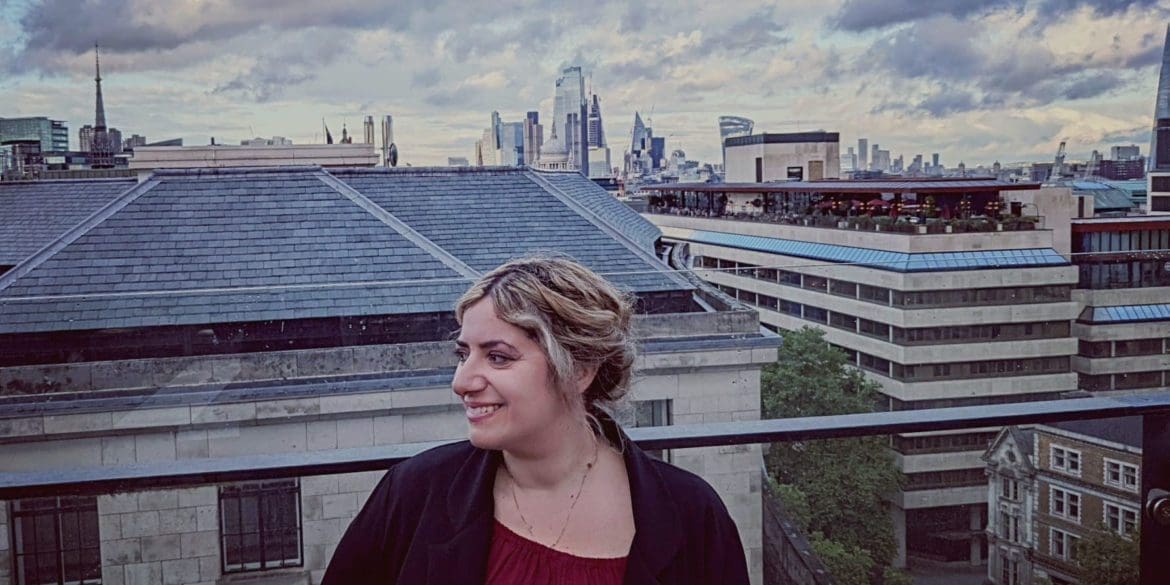 Gaby Sambuccetti celebrates on a London rooftop after receiving the prestigious Cosmos Davenport-Hines Prize for poetry