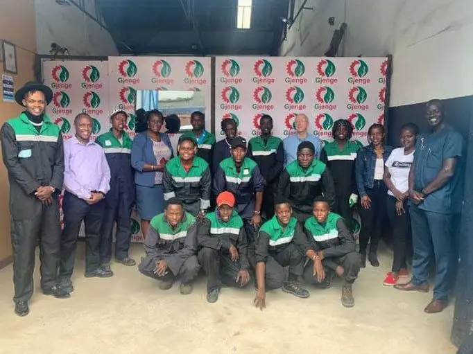 Nzambi Matee pictured with the workers from Gjenge Makers LTD
