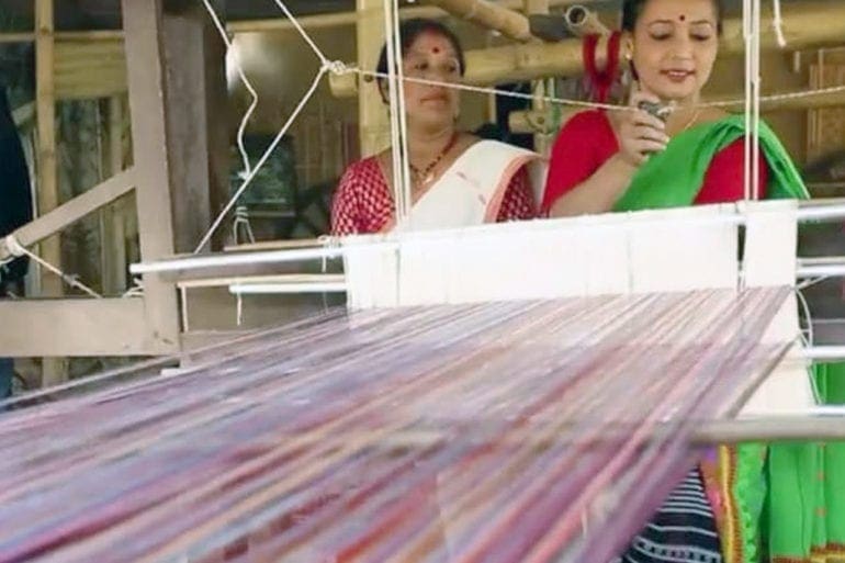 Rupjyoti Saikia Gogoi mixing plastic with cotton threads at her loom in Bocha Gaon village in Assam