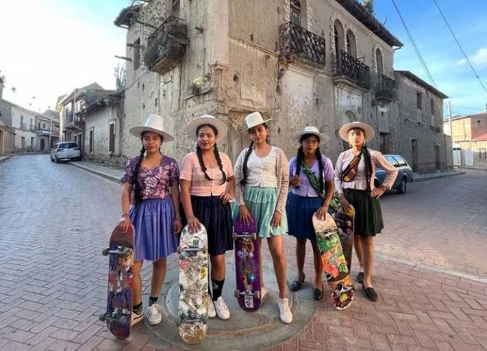 The young women of Imilla Skate in Bolivia skateboard in traditional chola attire