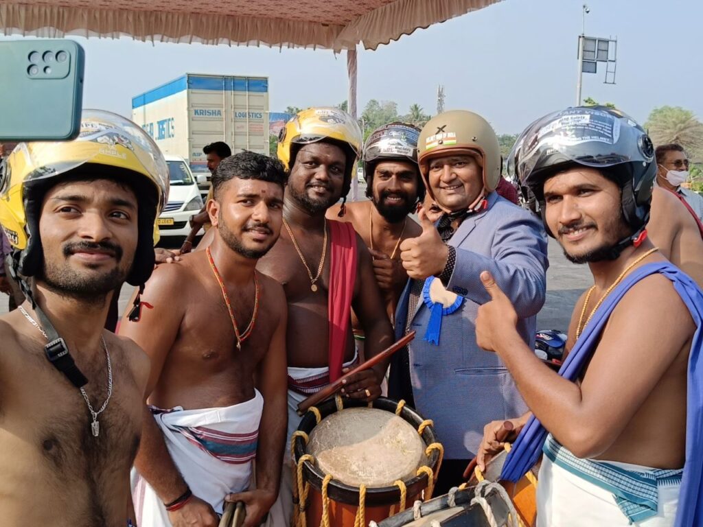 The Helmet Man in India pictured with local drummers in 