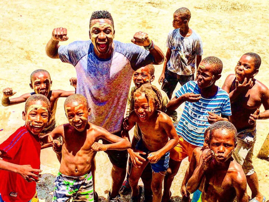 Jimmy Amisial pictured with a group of kids he works with in Haiti