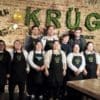 Neurodivergent people with different intellectual disabilities who work at Krug Café celebrate the inclusive organization's one year anniversary
