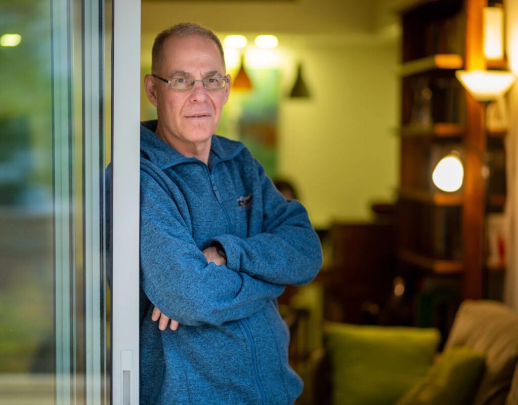 Israeli teacher Meir Baruchin photographed at home nearly two years after his arrest over Facebook posts about Gaza.