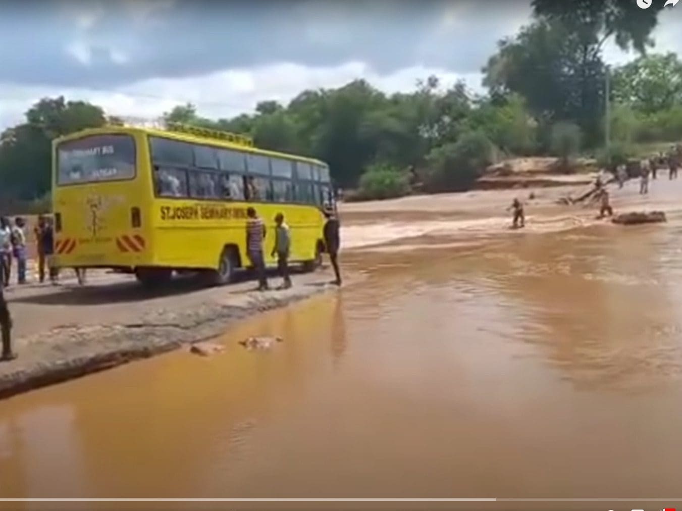 Seconds before the bus tipped into the flooded Enziu River. So far, the death toll is at 33, including several children