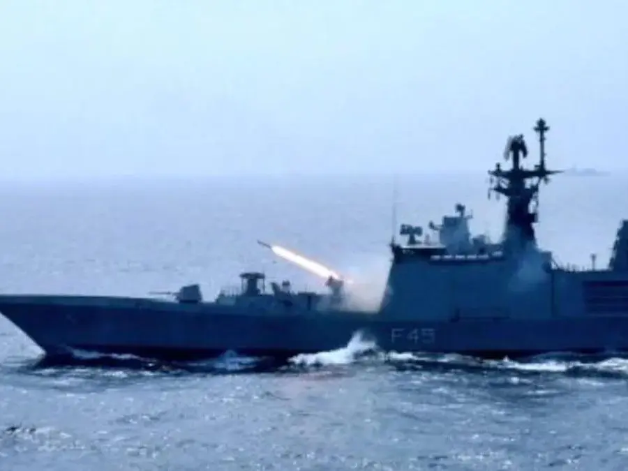 A ship from the Indian Navy fires a missile from the sea