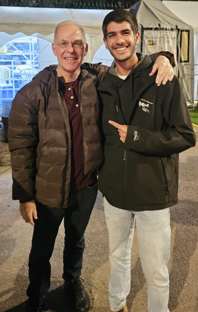 Israeli teacher Meir Baruchin with one of his students after returning to teaching.