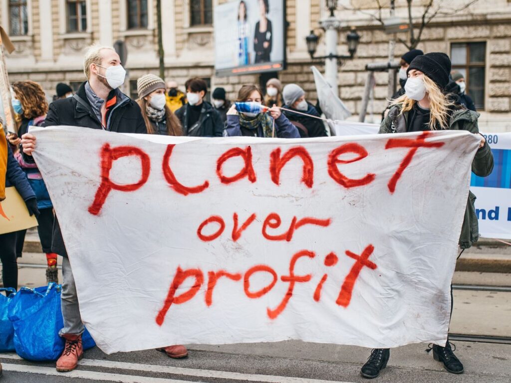 Representative image of protestors at the at the Global Climate Strike holding a banner with the message 