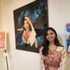 of some of her work at the opening event of the Cultural Fusion art exhibit