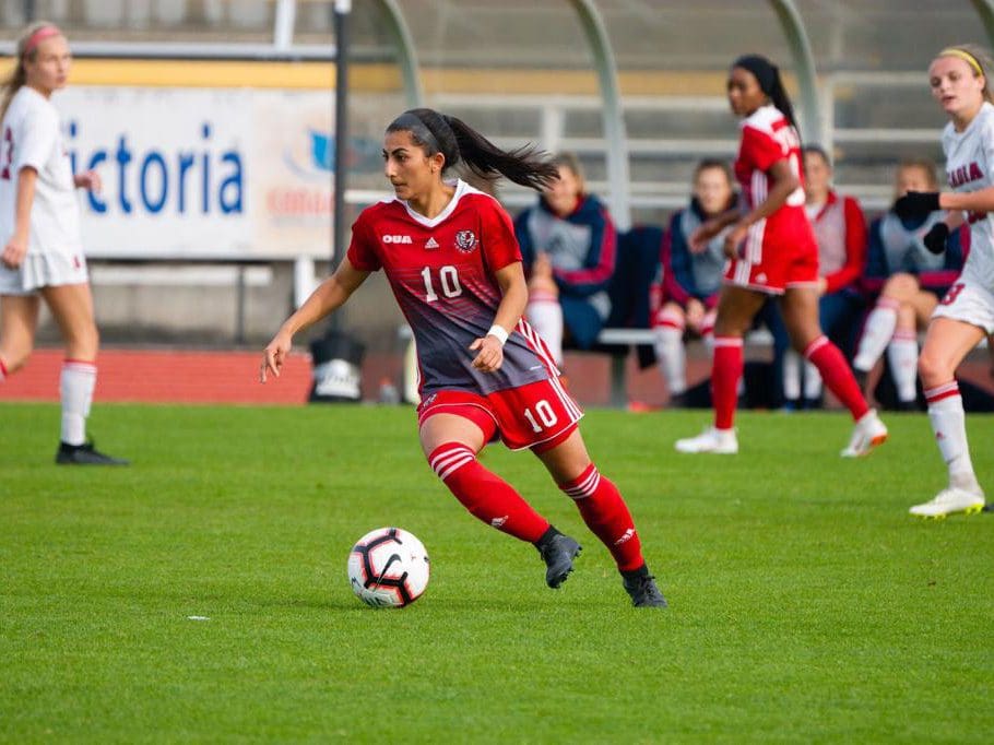 Farkhunda Muhtaj, 23, dribbles the ball for the York University Lions in Toronto, Canada. Muhtaj was instrumental in helping evacuate 26 Afghan Junior Women’s Team players and their families to safety in August.