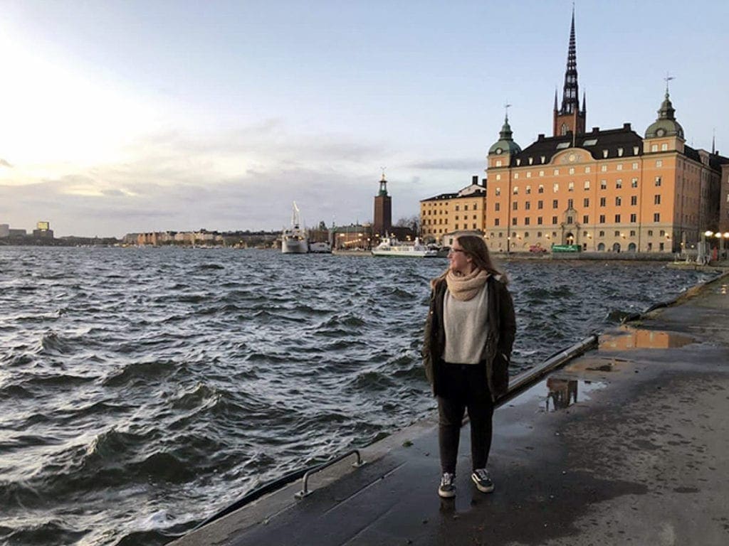 Camila Hernández stands at the waterfront in Sweden.