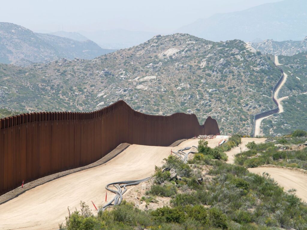 The Mexican-American border with some construction still ongoing on the American side in El Campo, California | Photo courtesy of Greg Bulla on Unsplash