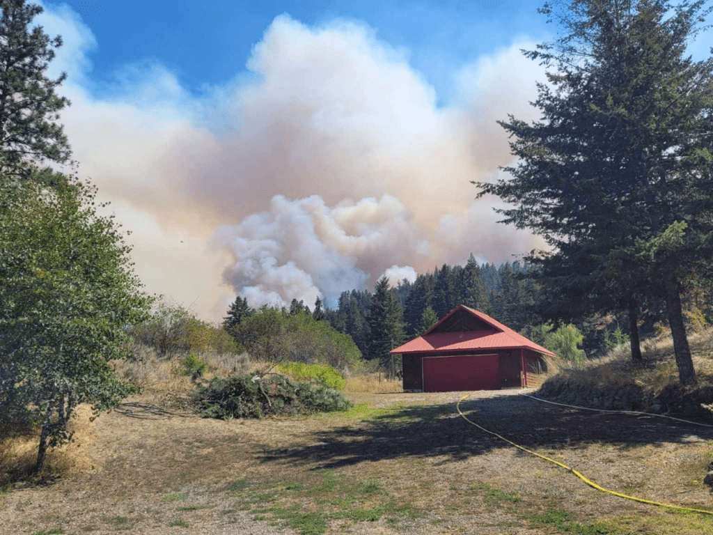 <b>Wildfire smoke is in sight from Cristal Macor's backyard.</b>