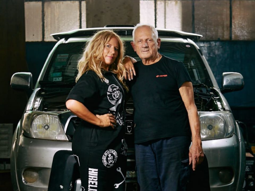 Alejandra Hartman and her father stand together at the Lady Fierros car clinic | Photo courtesy of Alejandra Hartman