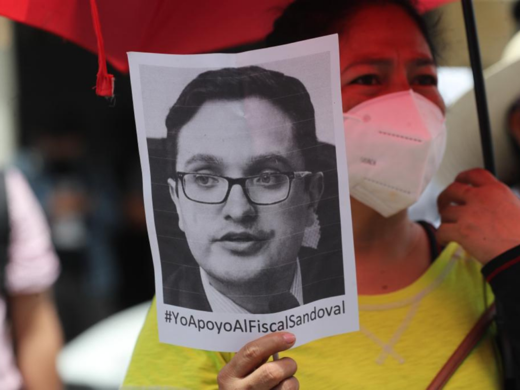Protestor displaying a flyer with an image of former public prosecutor Juan Sandoval | Photo courtesy of Juan Francisco Sandoval Alfaro