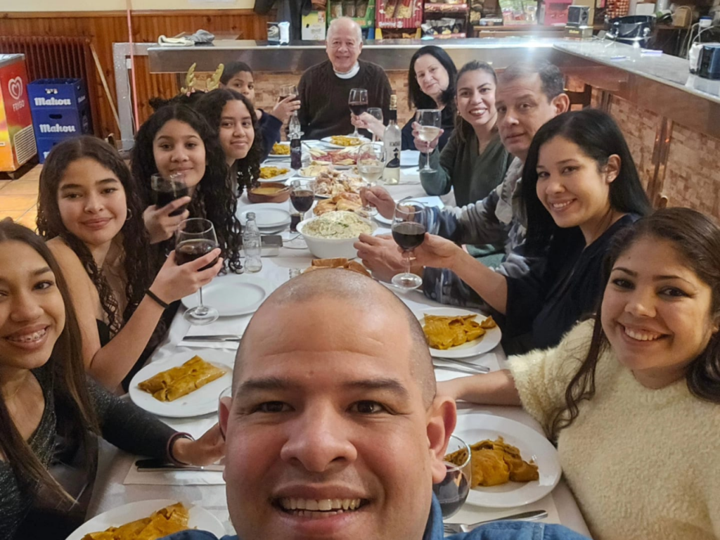 Venezuelan family enjoys a celebratory meal together in Spain. | Photo courtesy of Soraida Ledezma