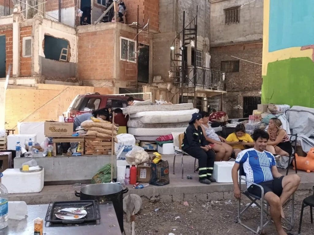 An entire row of houses was destroyed due to operator error, leaving 30 families without a home. They slept under the bridge of the highway for days.