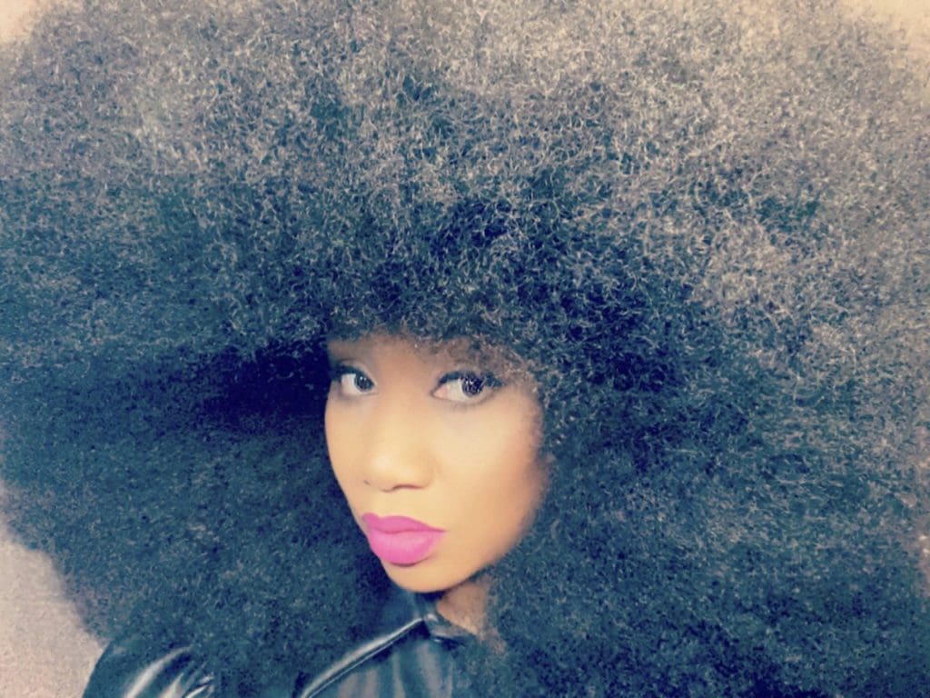 Aevin Dugas is a fourth time winner of the world's largest afro. After years of damaging it with chemicals, she decided to embrace her natural hair. Since then, her confidence and self-love grew, and she hopes to send a message to all young black children everywhere that their natural hair is beautiful. 