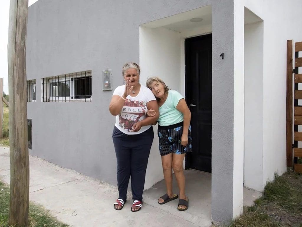 Flavia (left) with her friend Norma, one of the three women with whom she shares her new house after 20 years of living in a psych ward. They formed a friendship as roommates in the hospital, and remain close ever since. 
