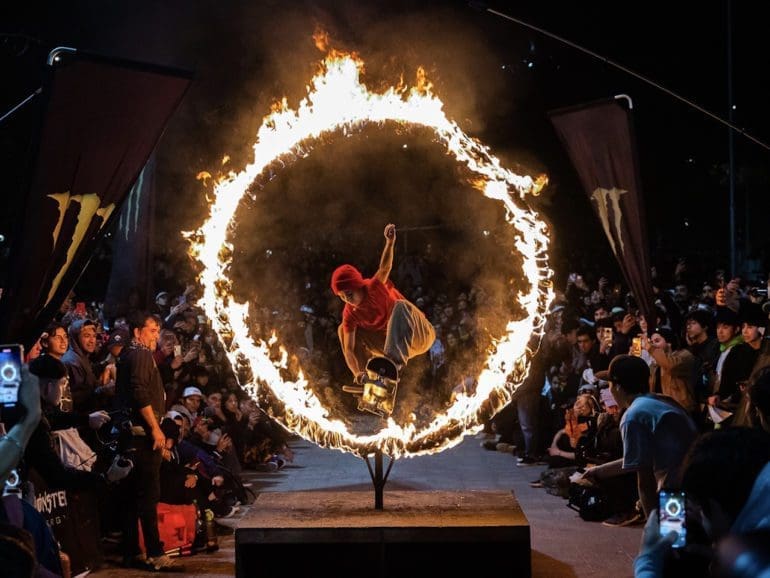 Skaters perform through a ring of fire at Chile’s annual Go Skateboarding event