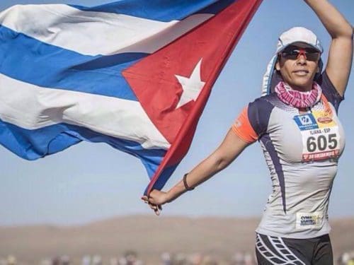 Iliana Hernandez, who is on house arrest for protesting the Cuban government, is pictured waving a Cuban flag.