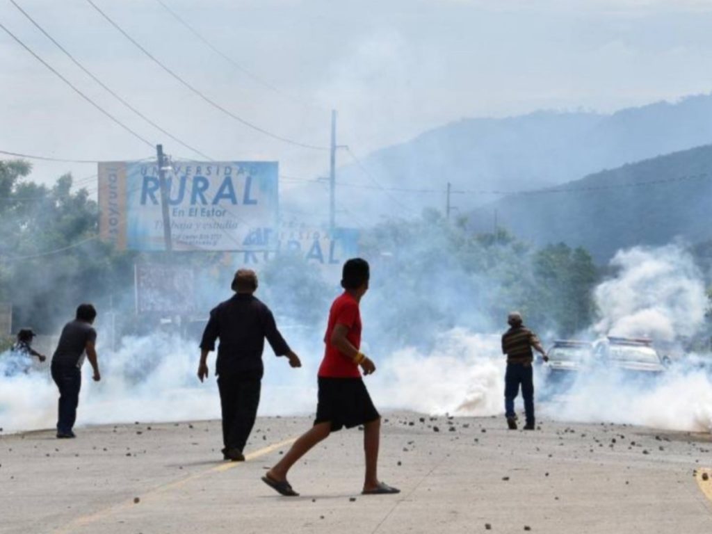 The demonstration in El Estor where Carlos Maaz was tragically killed, enveloped in clouds of tear gas.