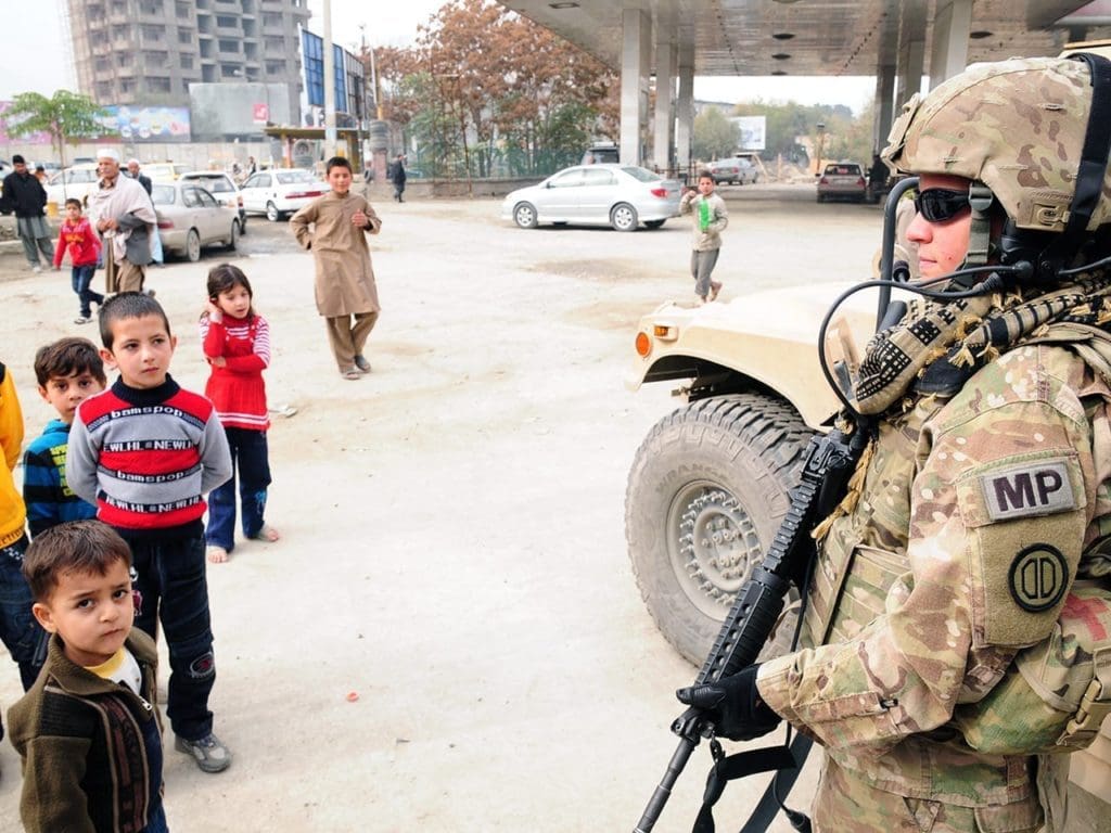 A soldier mentors Afghan police in Kabul.
