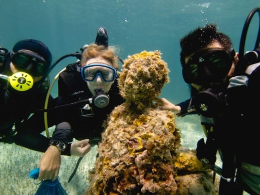 Biologist Heather Spence installs underwater microphones on the world’s second-largest barrier reef to capture sound recordings. | Photo courtesy of 