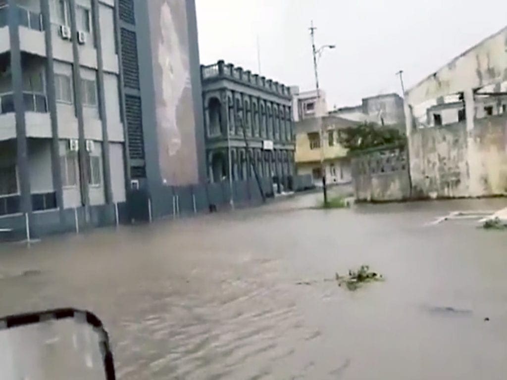 Flooding in Beira inner city. Roofs of many of the cities buildings are seen to have collapsed.